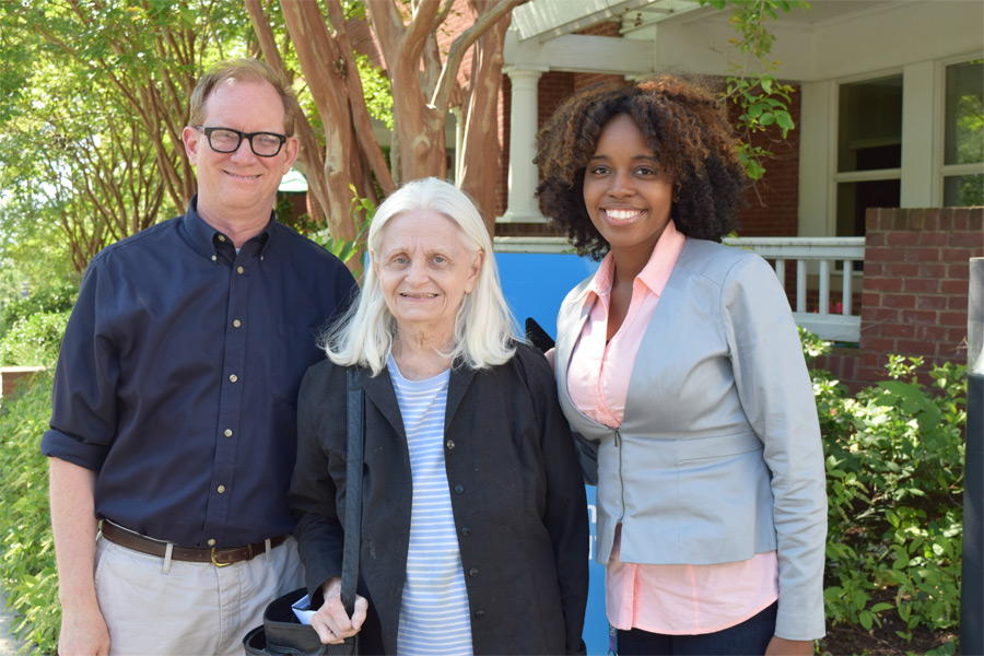 Louise Pearson (center) found a new support system with Iona's Bill Amt and Malika Moore. 